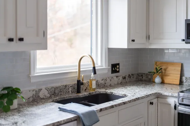 a kitchen with a sink and cabinets