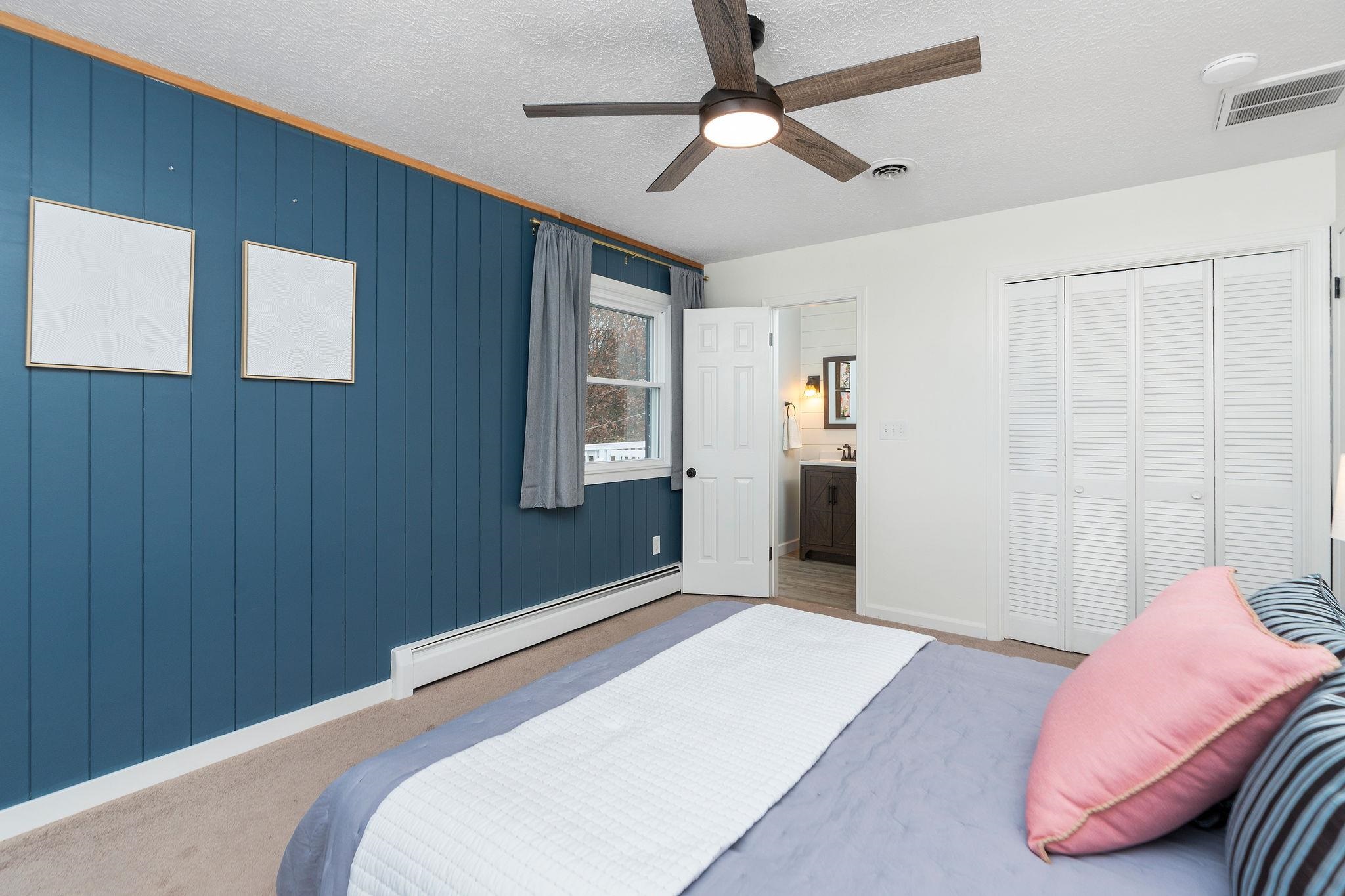 1222 Pinehurst Road Staunton, VA 24401 - Photo 21 of 52 a bedroom with a bed and a chandelier