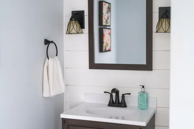 a bathroom with a sink and a mirror