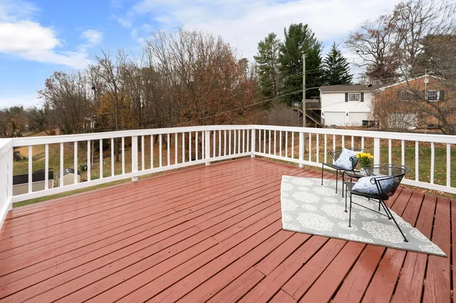 a view of a chairs and table on the deck