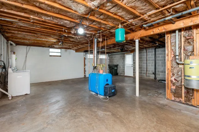 a view of a house with backyard porch and sitting area