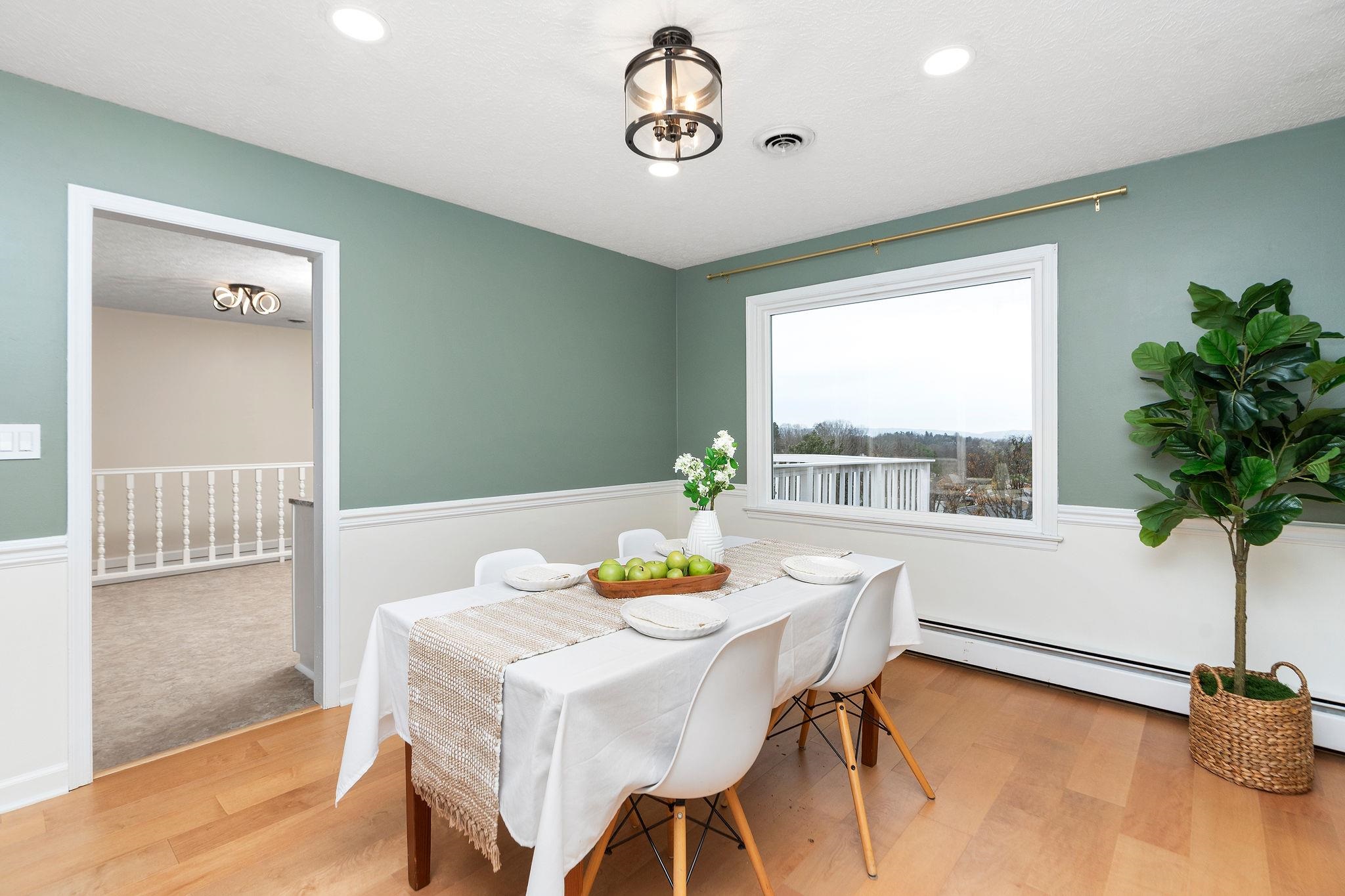 1222 Pinehurst Road Staunton, VA 24401 - Photo 9 of 52 a view of a dining room with furniture window and flowerpot