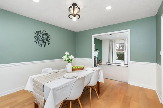 a dining room with a table and chairs