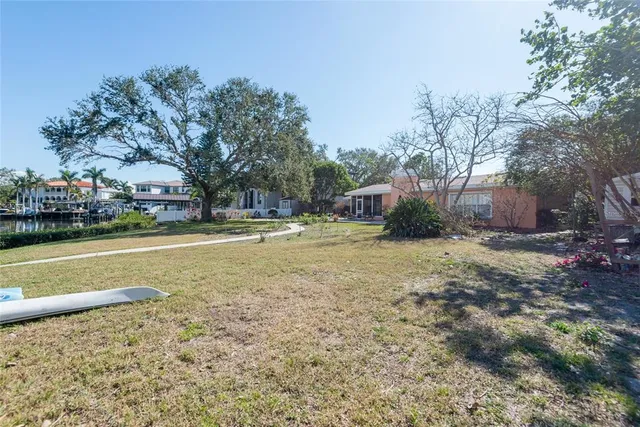 a view of outdoor space with playground and green space