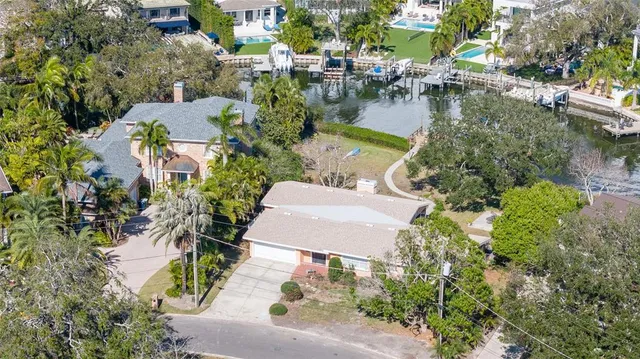 an aerial view of residential house with outdoor space and lake view