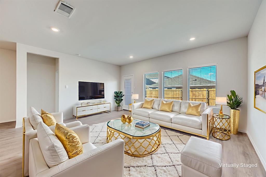 3433 Marie Drive Sherman, TX 75090 - Photo 3 of 39 a living room with furniture and a flat screen tv
