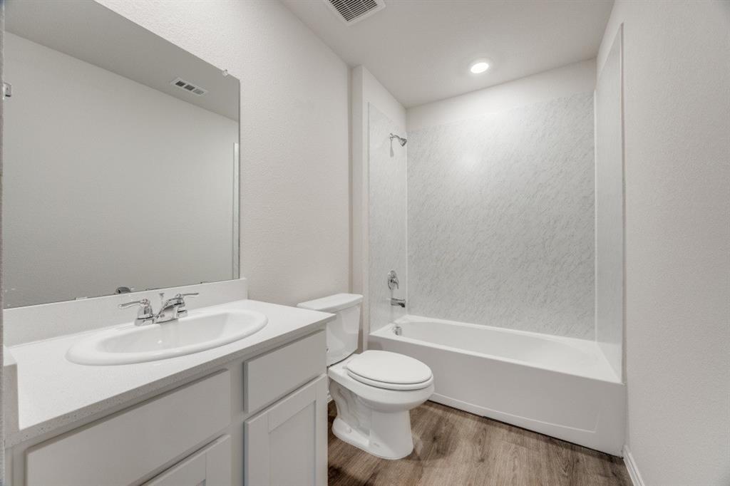 3433 Marie Drive Sherman, TX 75090 - Photo 32 of 39 a bathroom with a sink toilet and shower