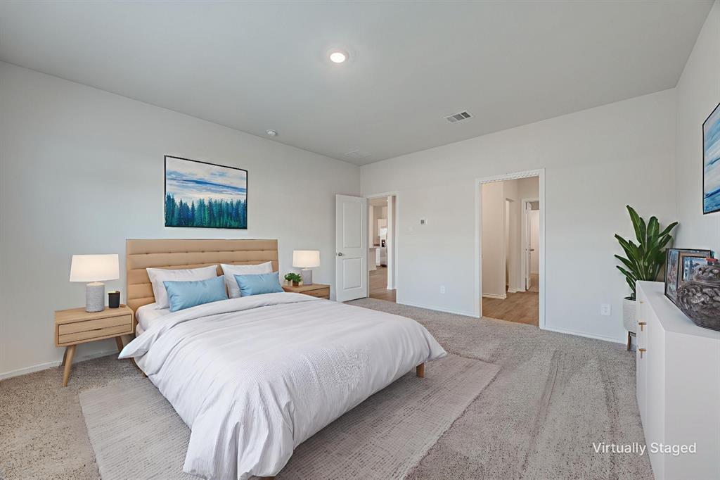 3433 Marie Drive Sherman, TX 75090 - Photo 6 of 39 a bedroom with a large bed and a potted plant