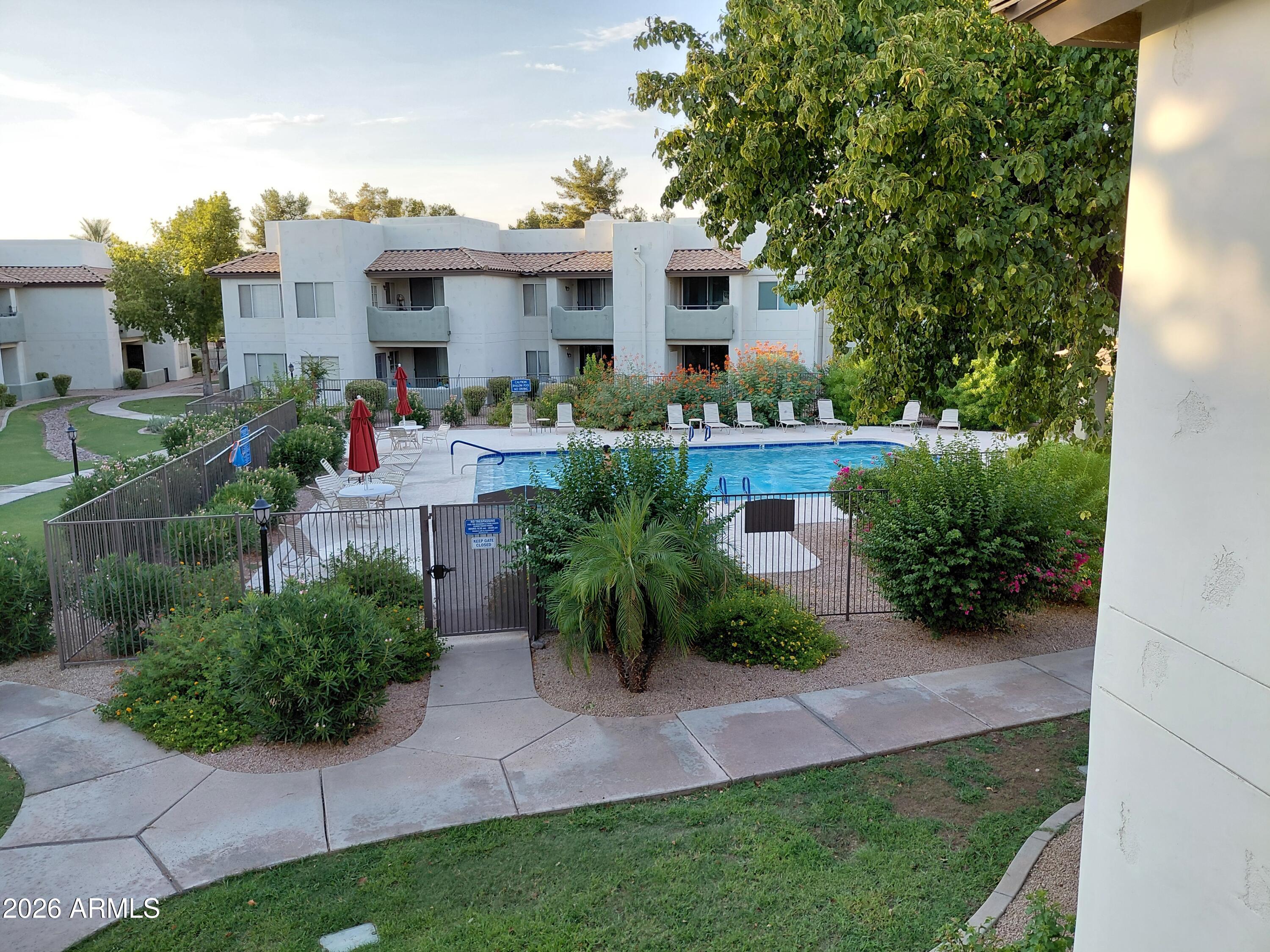 1825 West Ray Road, Unit 2044 Chandler, AZ 85224 - Photo 14 of 14 a front view of house with yard and outdoor seating