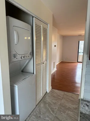 a view of hallway with washer and dryer