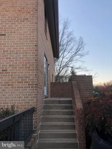 a view of entryway with brick walls
