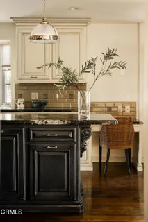 a bedroom with a bed and a mirror