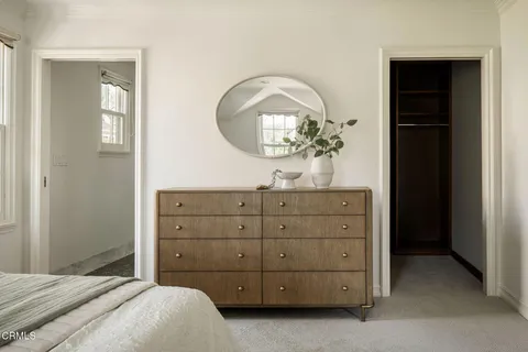 a view of a bathroom with a door and a white door