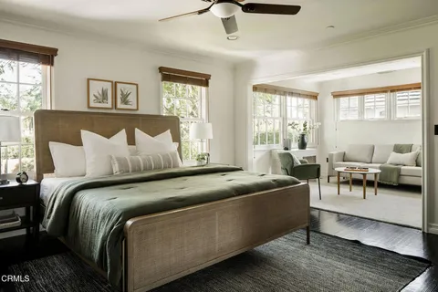 a bathroom with a bathtub and a window