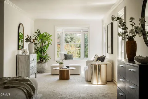 a view of swimming pool with lounge chairs