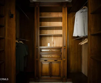 a view of a white house with a big yard and large trees