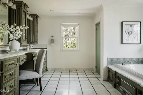 a front view of a house with garden and porch