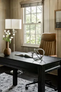 a view of a livingroom with furniture and wooden floor