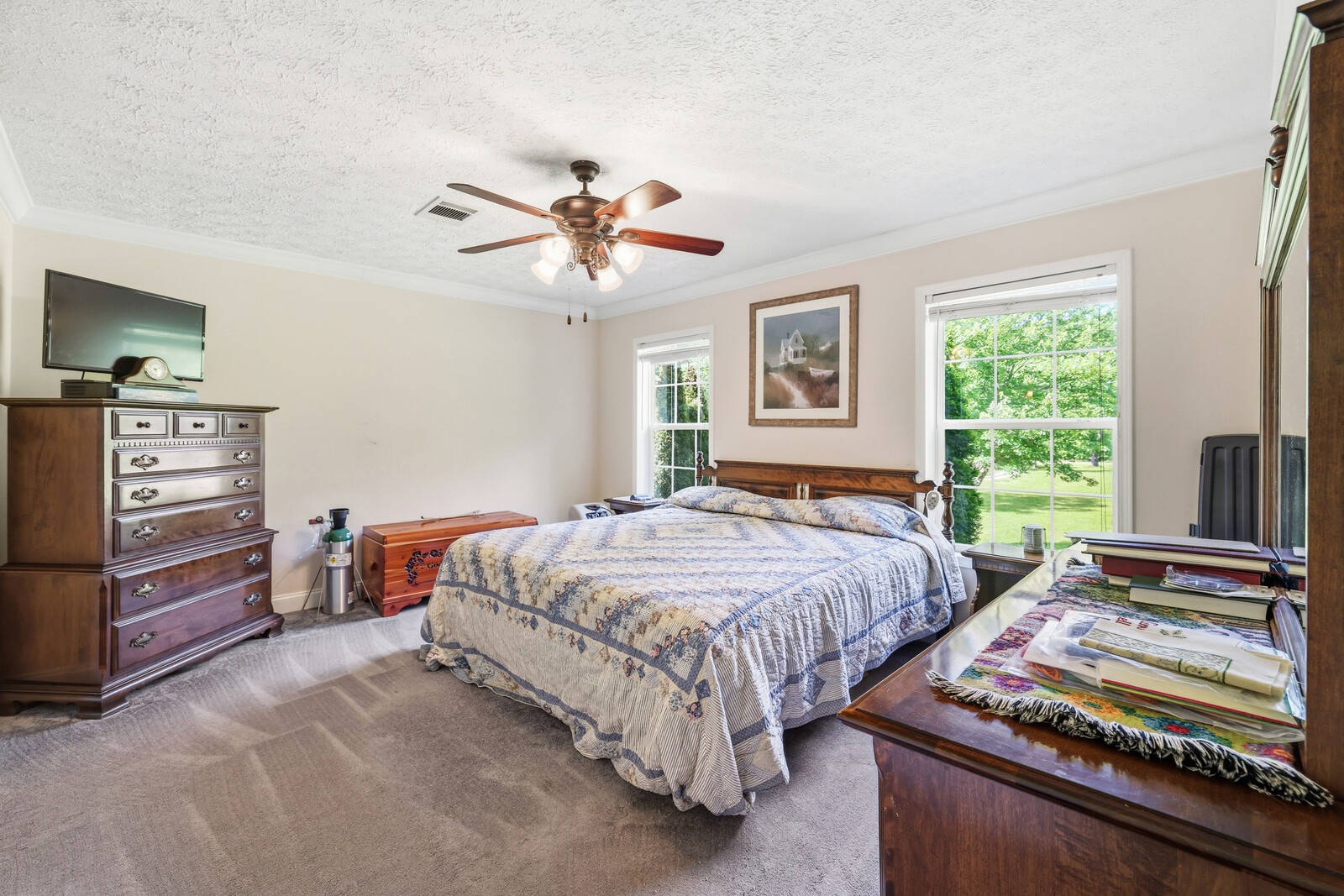 1637 Upper Standing Rock Road Dover, TN 37058 - Photo 17 of 57 a bedroom with a bed and a chandelier