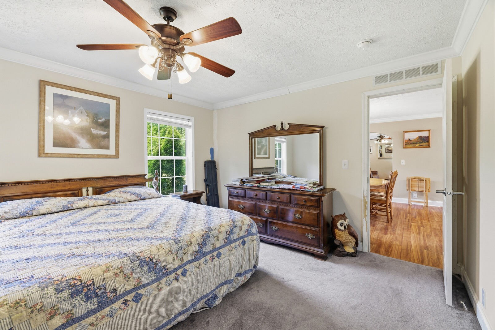 1637 Upper Standing Rock Road Dover, TN 37058 - Photo 18 of 57 a bedroom with a bed and a chandelier