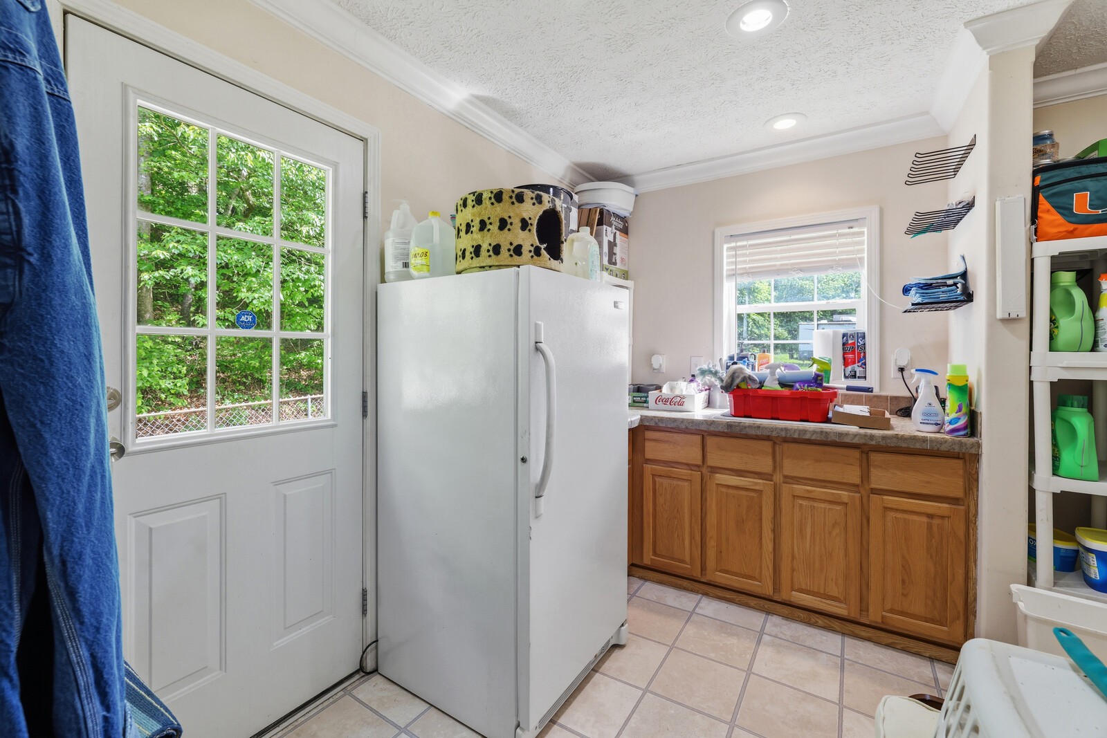 1637 Upper Standing Rock Road Dover, TN 37058 - Photo 27 of 57 a white refrigerator freezer sitting inside of a kitchen