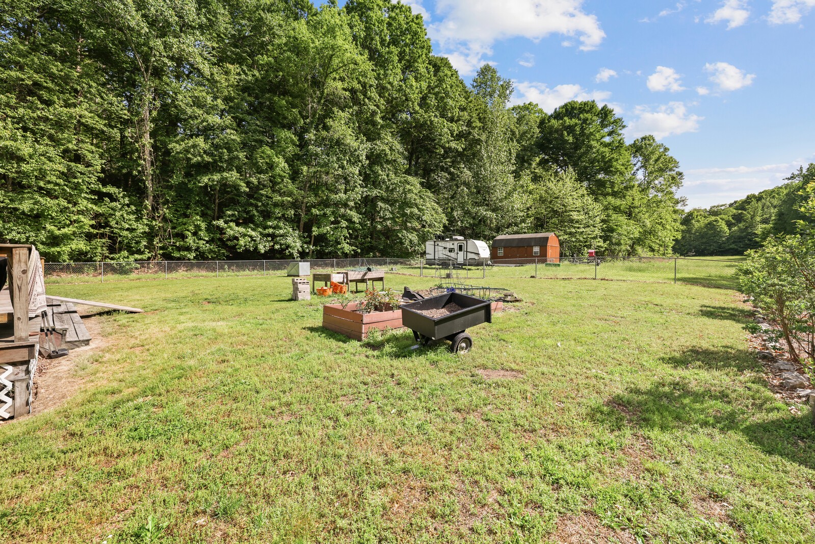 1637 Upper Standing Rock Road Dover, TN 37058 - Photo 34 of 57 a backyard of a house with table and chairs