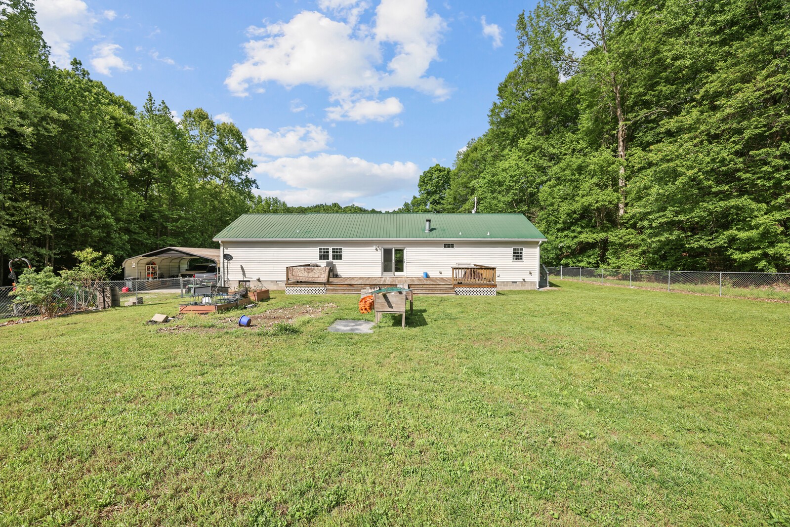 1637 Upper Standing Rock Road Dover, TN 37058 - Photo 36 of 57 a front view of house with yard and trees