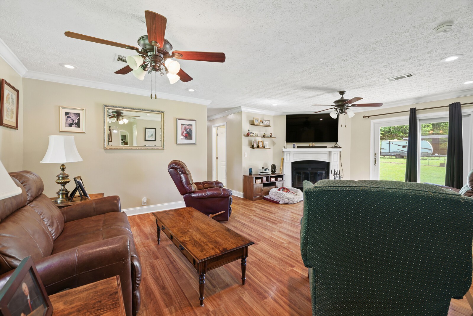 1637 Upper Standing Rock Road Dover, TN 37058 - Photo 5 of 57 a living room with furniture a fireplace and a flat screen tv