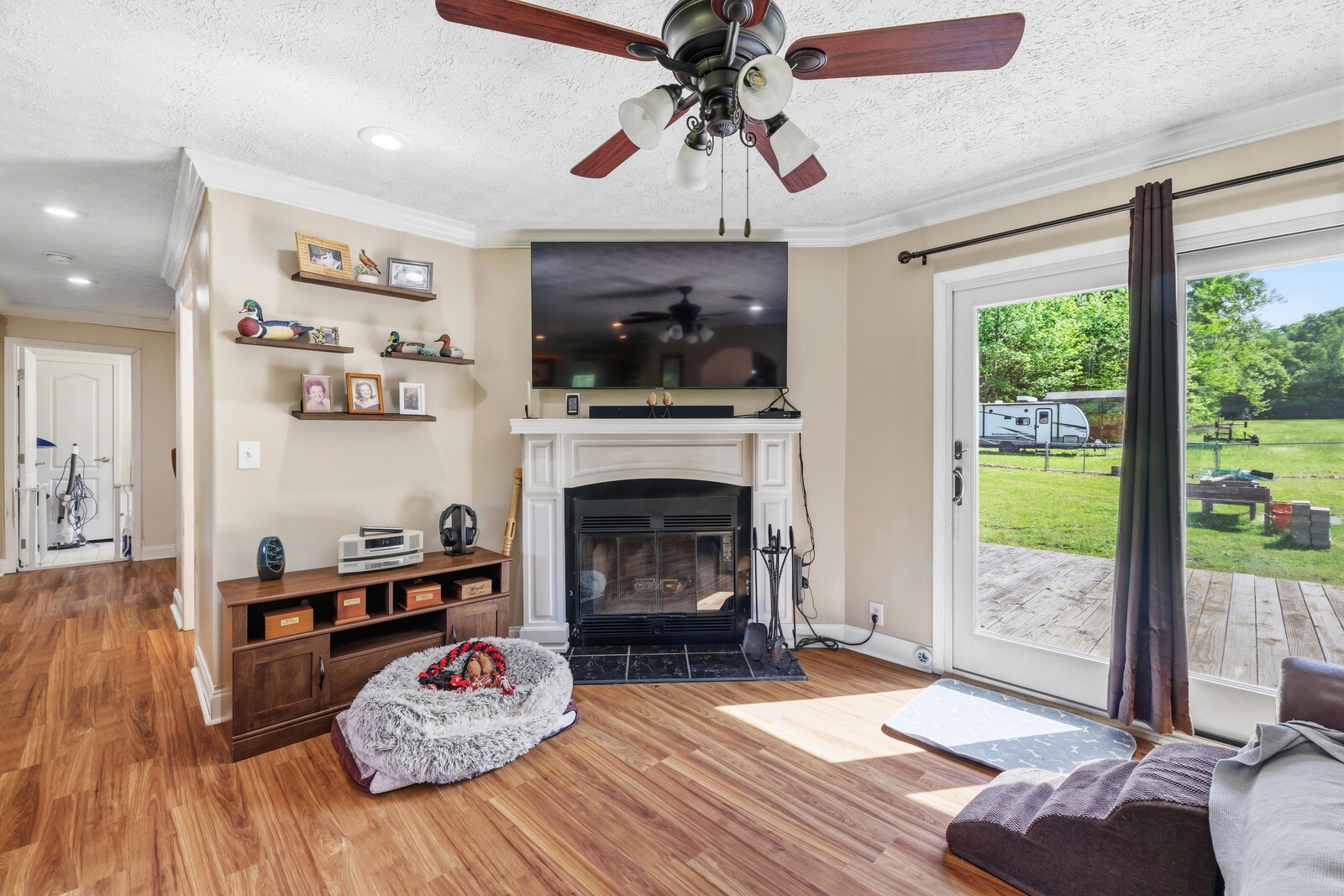 1637 Upper Standing Rock Road Dover, TN 37058 - Photo 8 of 57 a living room with furniture a fireplace and a flat screen tv