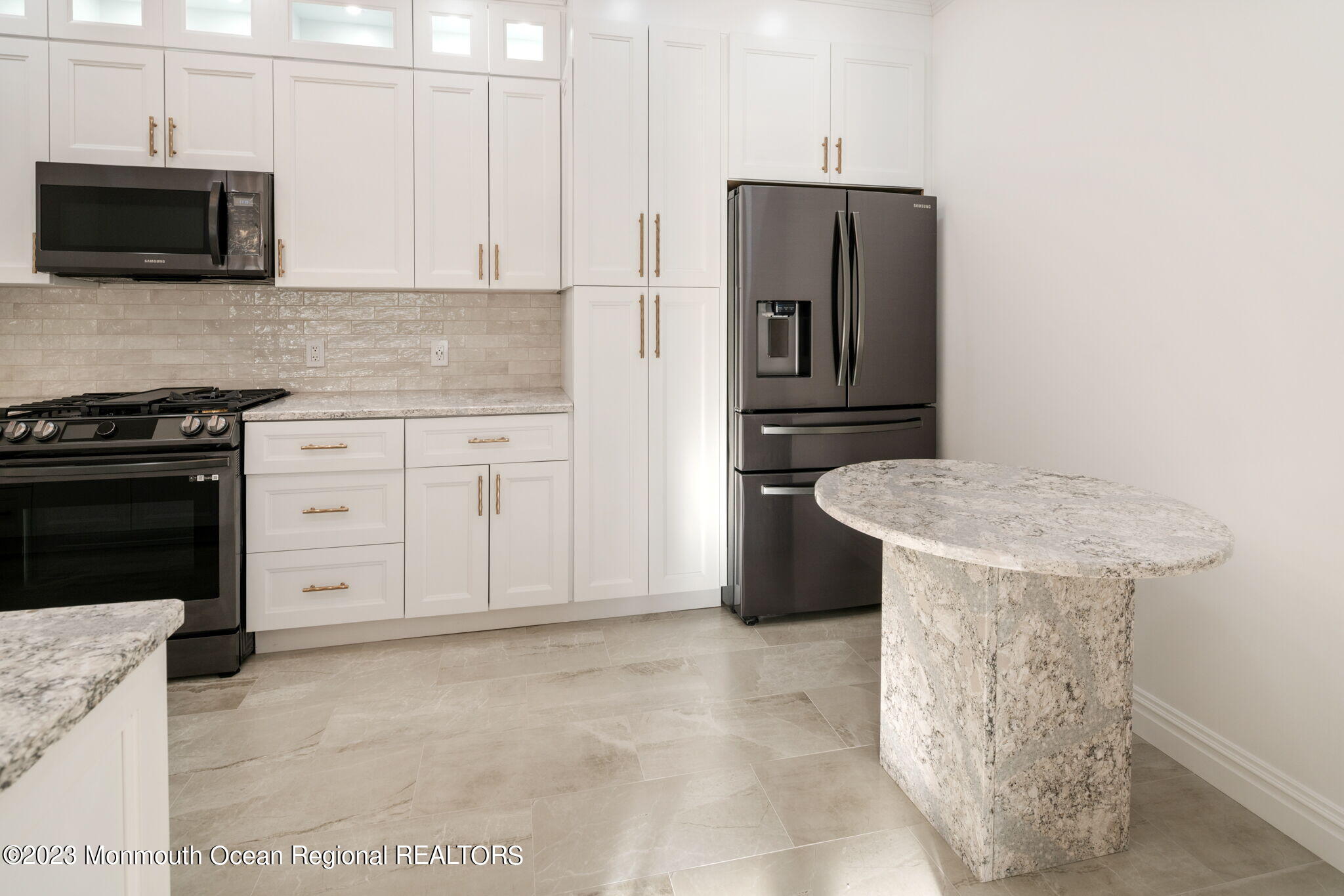 116 Potts Road Morganville, NJ 07751 - Photo 12 of 34 a kitchen with stainless steel appliances a stove microwave and refrigerator
