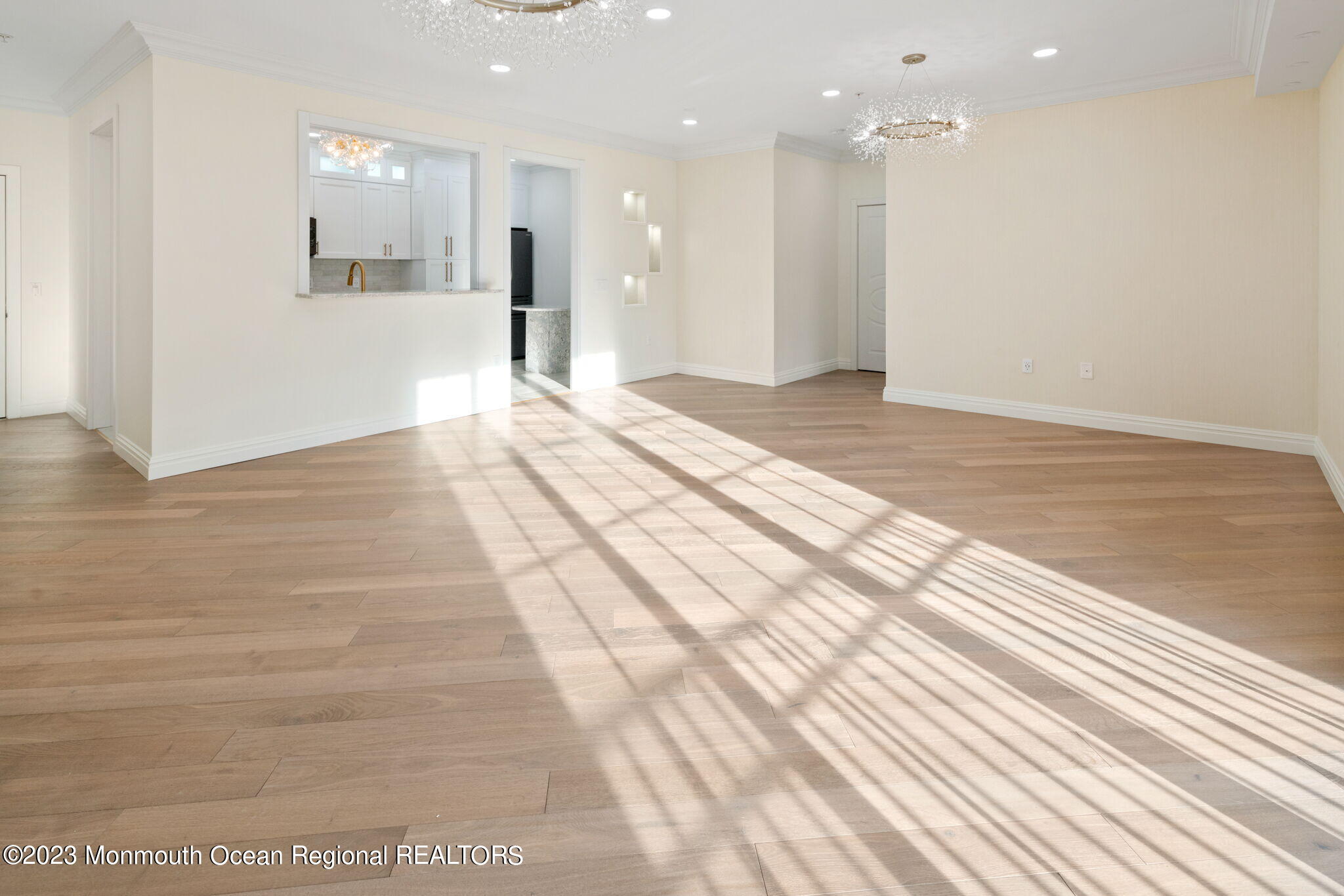 116 Potts Road Morganville, NJ 07751 - Photo 17 of 34 a view of a big room with wooden floor and windows