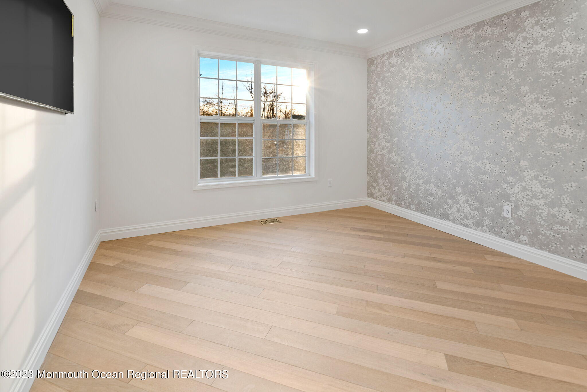 116 Potts Road Morganville, NJ 07751 - Photo 19 of 34 a view of an empty room with wooden floor and a window