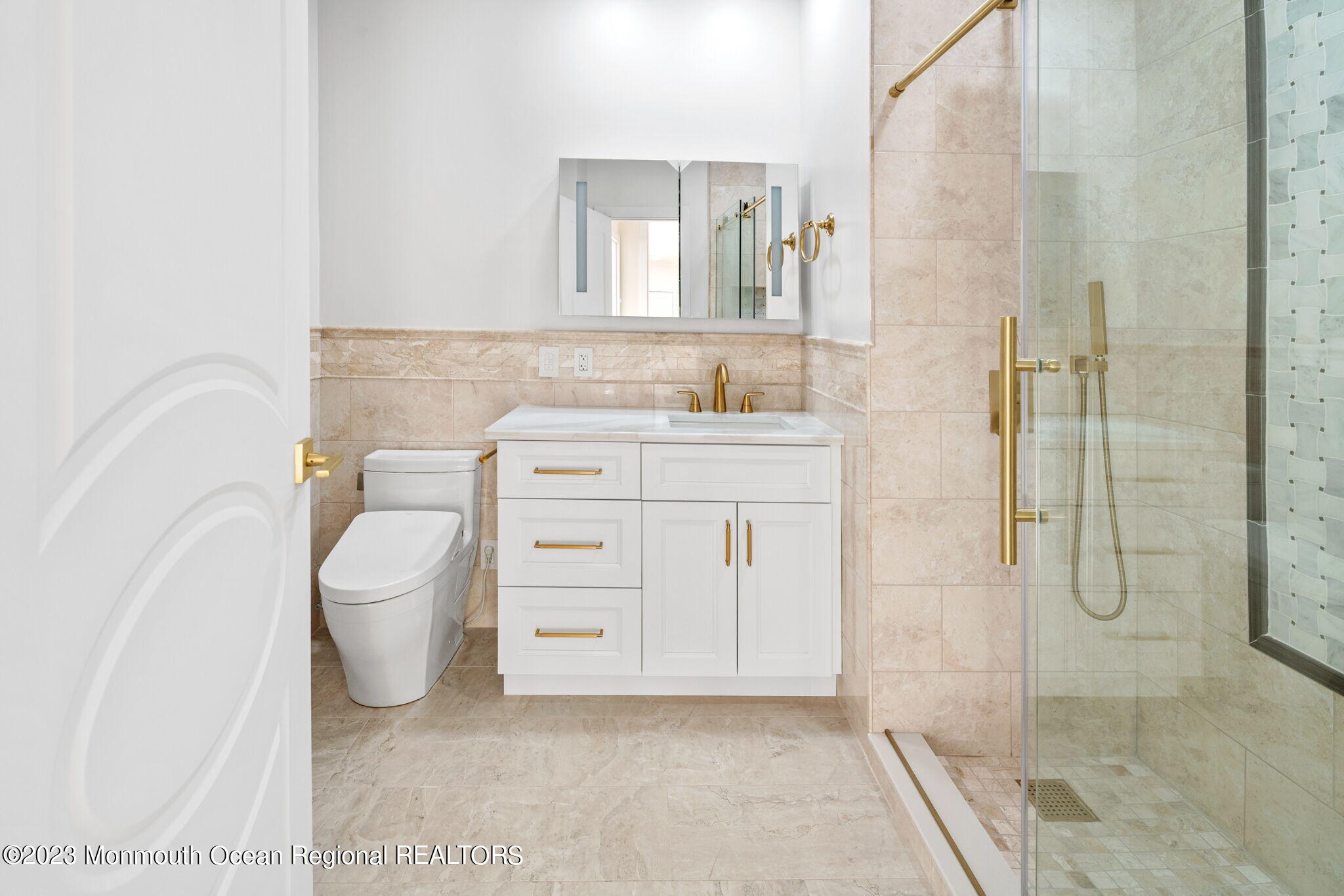 116 Potts Road Morganville, NJ 07751 - Photo 22 of 34 a bathroom with a granite countertop sink a toilet and shower