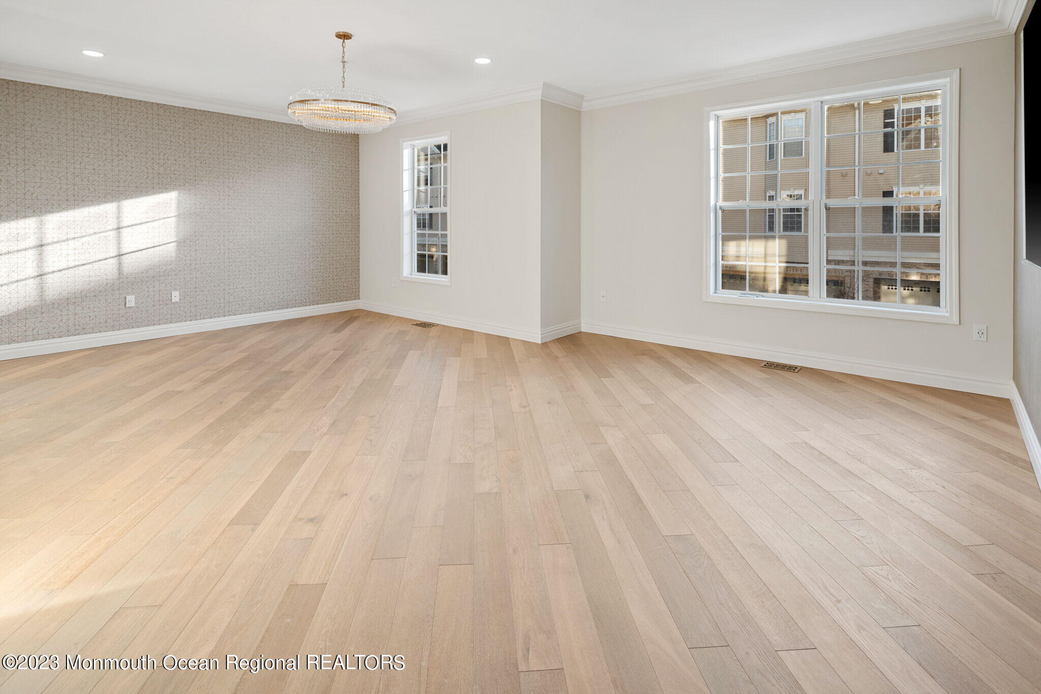 116 Potts Road Morganville, NJ 07751 - Photo 25 of 34 an empty room with wooden floor and windows