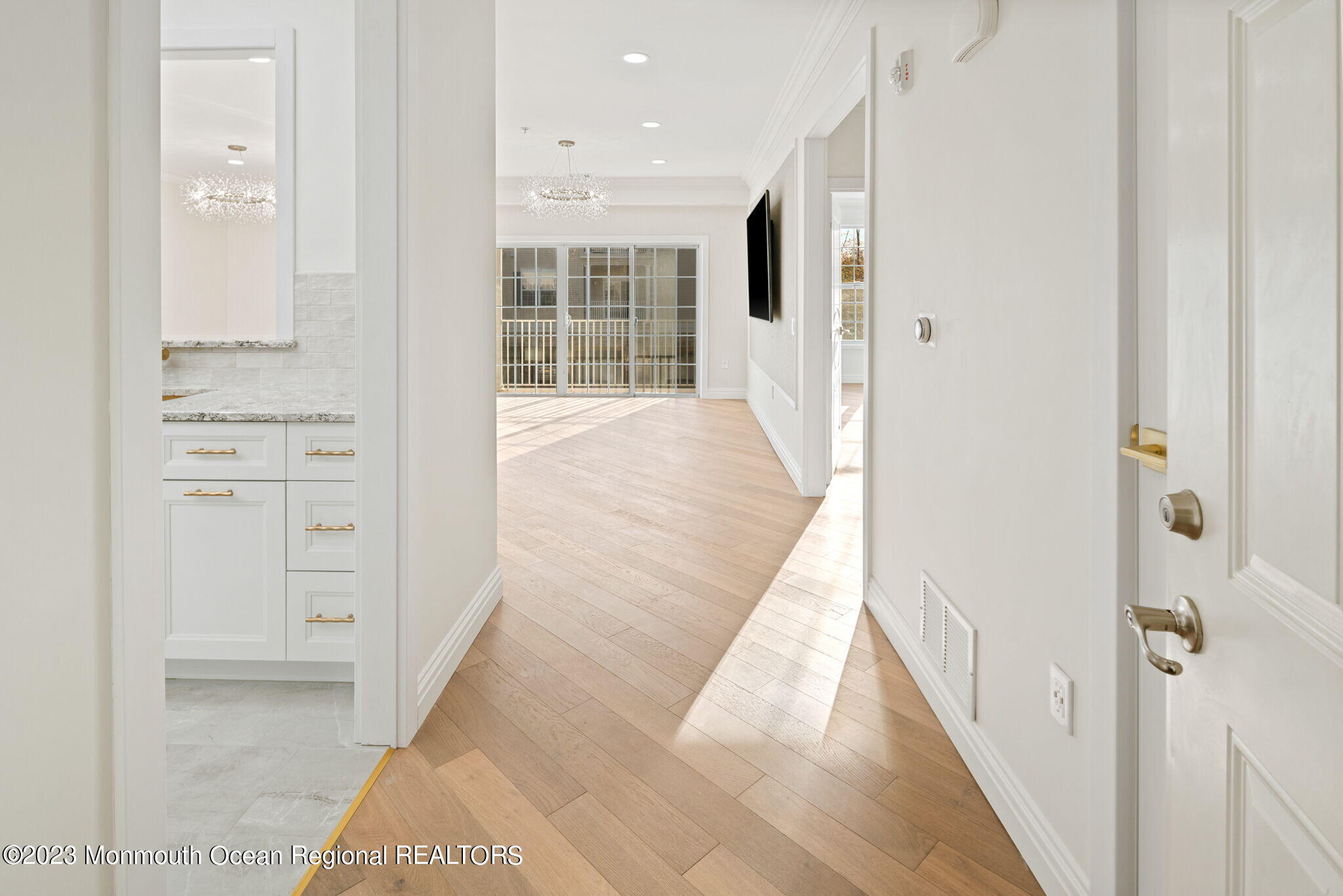 116 Potts Road Morganville, NJ 07751 - Photo 4 of 34 a view of a hallway with wooden floor and windows