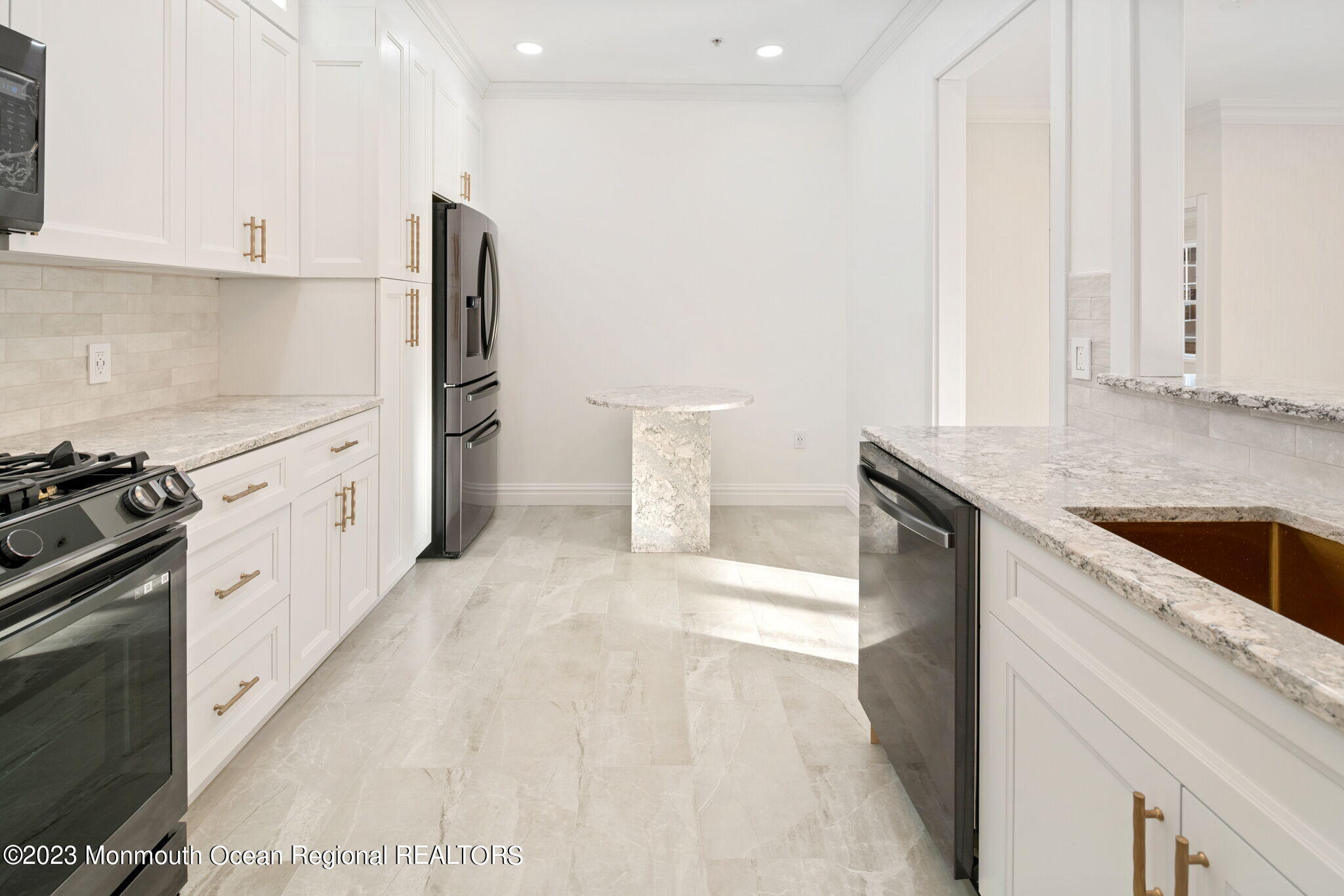 116 Potts Road Morganville, NJ 07751 - Photo 5 of 34 a kitchen with granite countertop white cabinets and white appliances