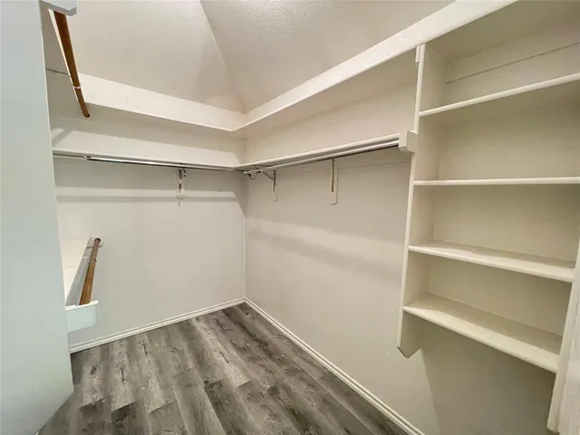 a view of an empty walk in closet