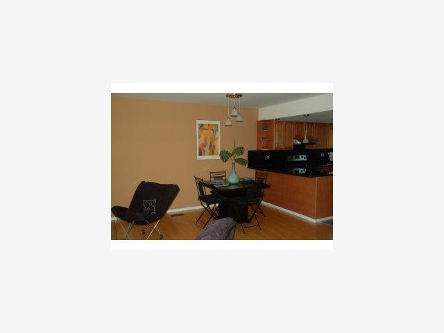 504 Monterey Road, Unit O Pacifica, CA 94044 - Photo 6 of 9 a living room with furniture and a potted plant