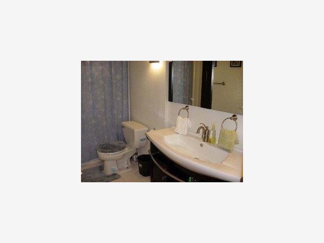 504 Monterey Road, Unit O Pacifica, CA 94044 - Photo 8 of 9 a bathroom with a sink and a toilet