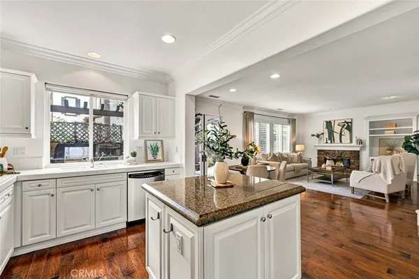 a kitchen with granite countertop living room and living room