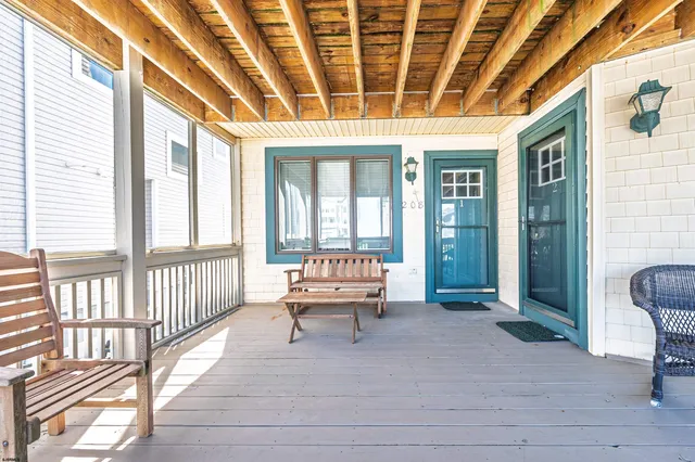 a view of a two chairs and table in the balcony