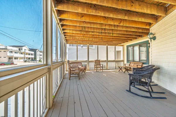 a view of a patio with a table and chairs