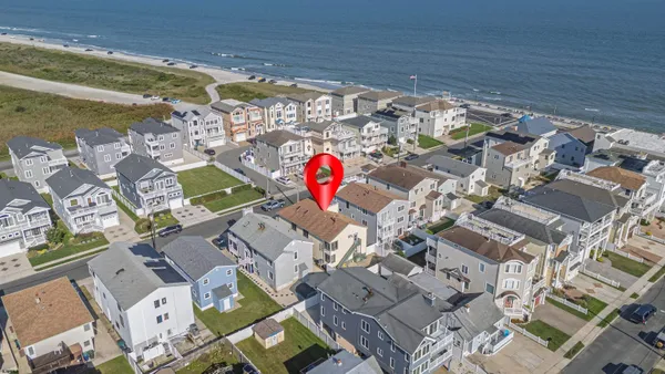 a bedroom with two beds and a window
