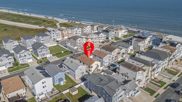 a front view of a building with a garden