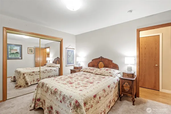 a bedroom with a bed and a dresser
