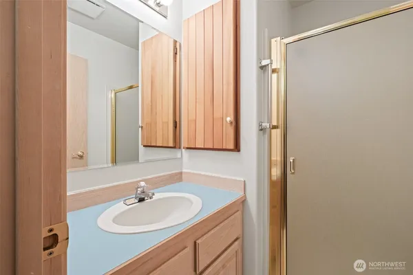 a bathroom with a sink and a mirror