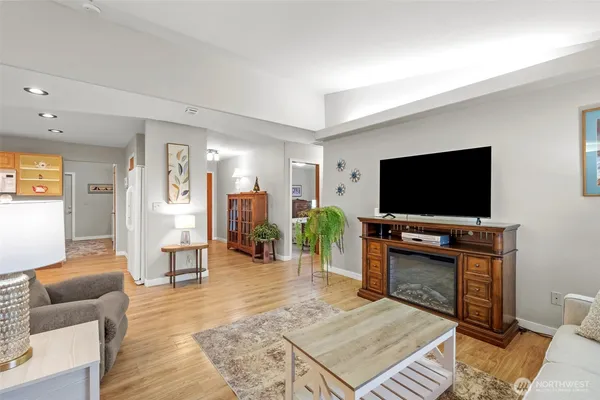 a living room with furniture and a flat screen tv