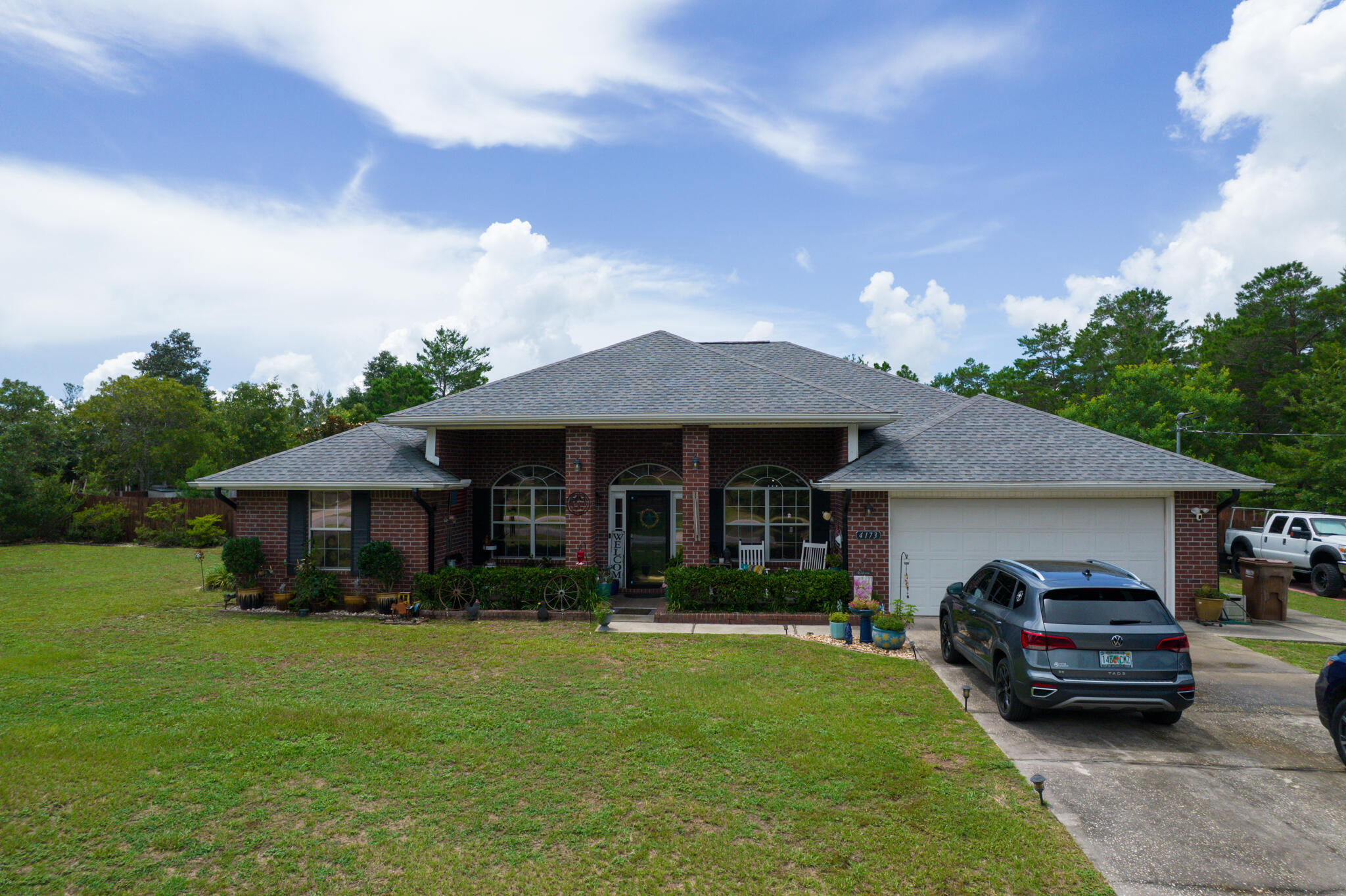 4173 Big Buck Trail Crestview, FL 32539 - Photo 3 of 38 a front view of a house with garden
