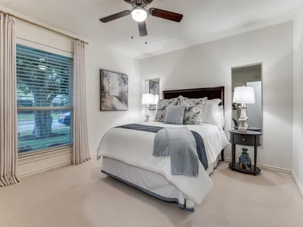 a spacious bathroom with a sink and a mirror