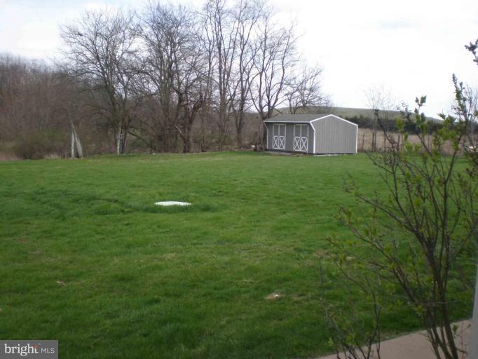 9130 Letzburg Road Mercersburg, PA 17236 - Photo 7 of 8 a view of a house with a backyard